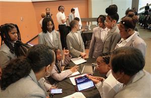 The debate team discussing ideas